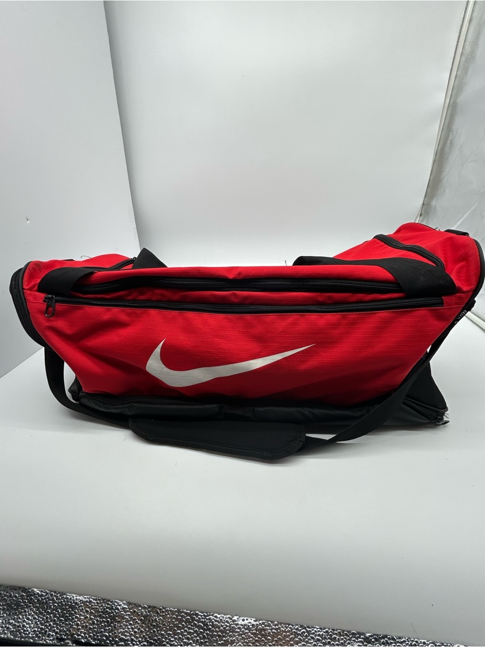 Nike Red Duffel Bag with White Swoosh and Black Accents Unisex